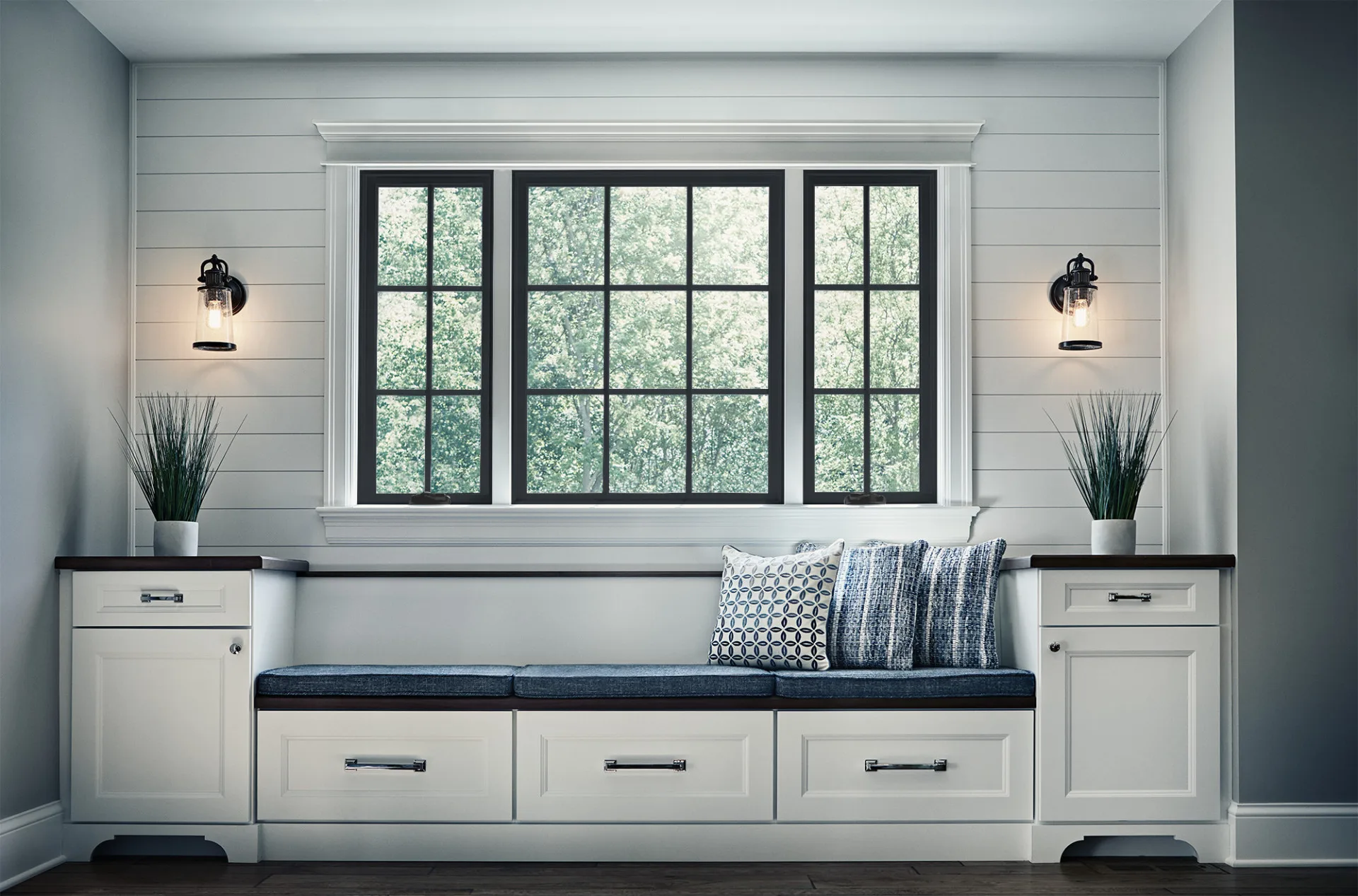 Black-framed JELD-WEN windows above a built-in window seat